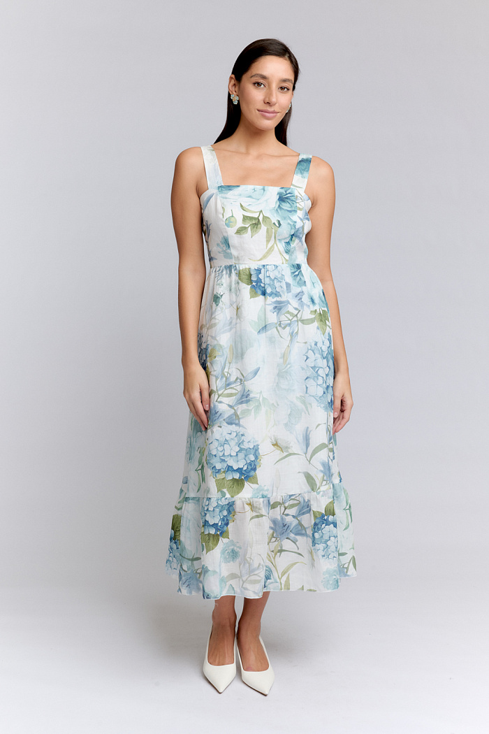 Платье-сарафан на бретелях длины миди. Юбка от талии свободного кроя. По низу волан.