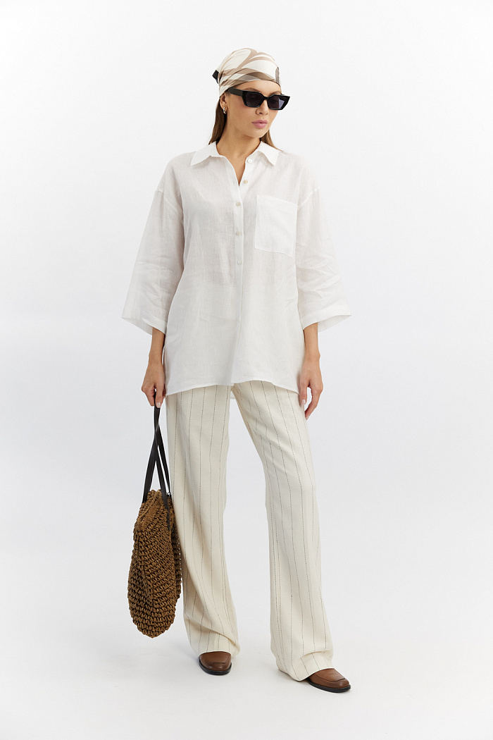 Рубашка свободного силуэта с накладным карманом по полочке,  по спинке глубокая складка. Рукав 7/8.